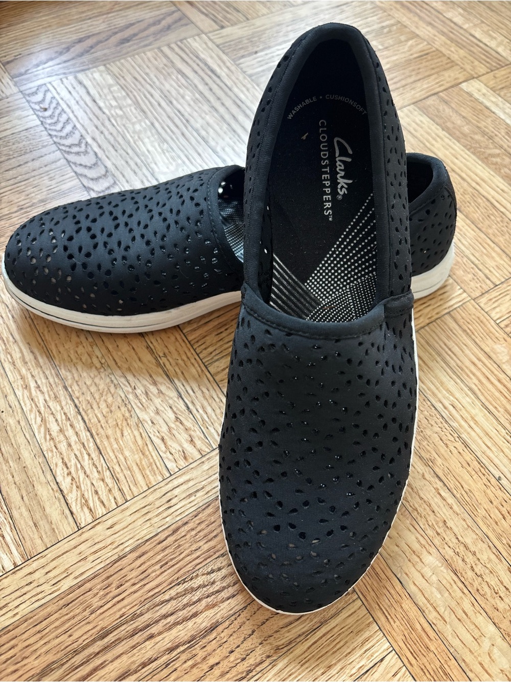 Clarks women’s Black Cloudsteppers Slip-On Shoes